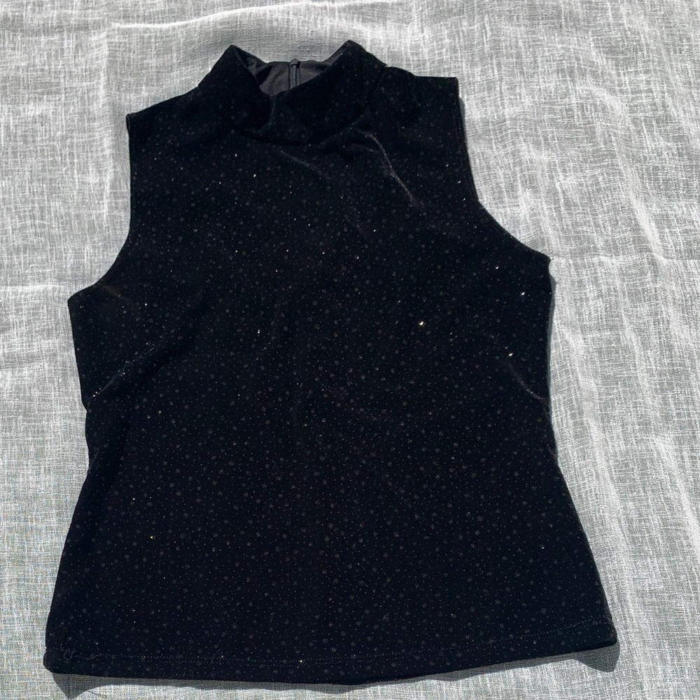 Sparkling black turtle neck top. No sleeves